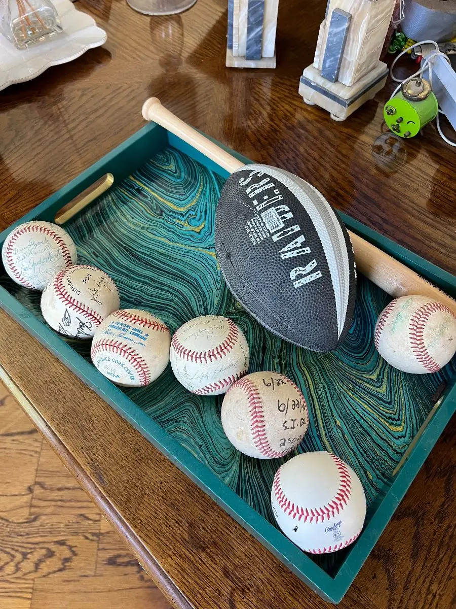Collection of autographed baseballs and sports memorabilia